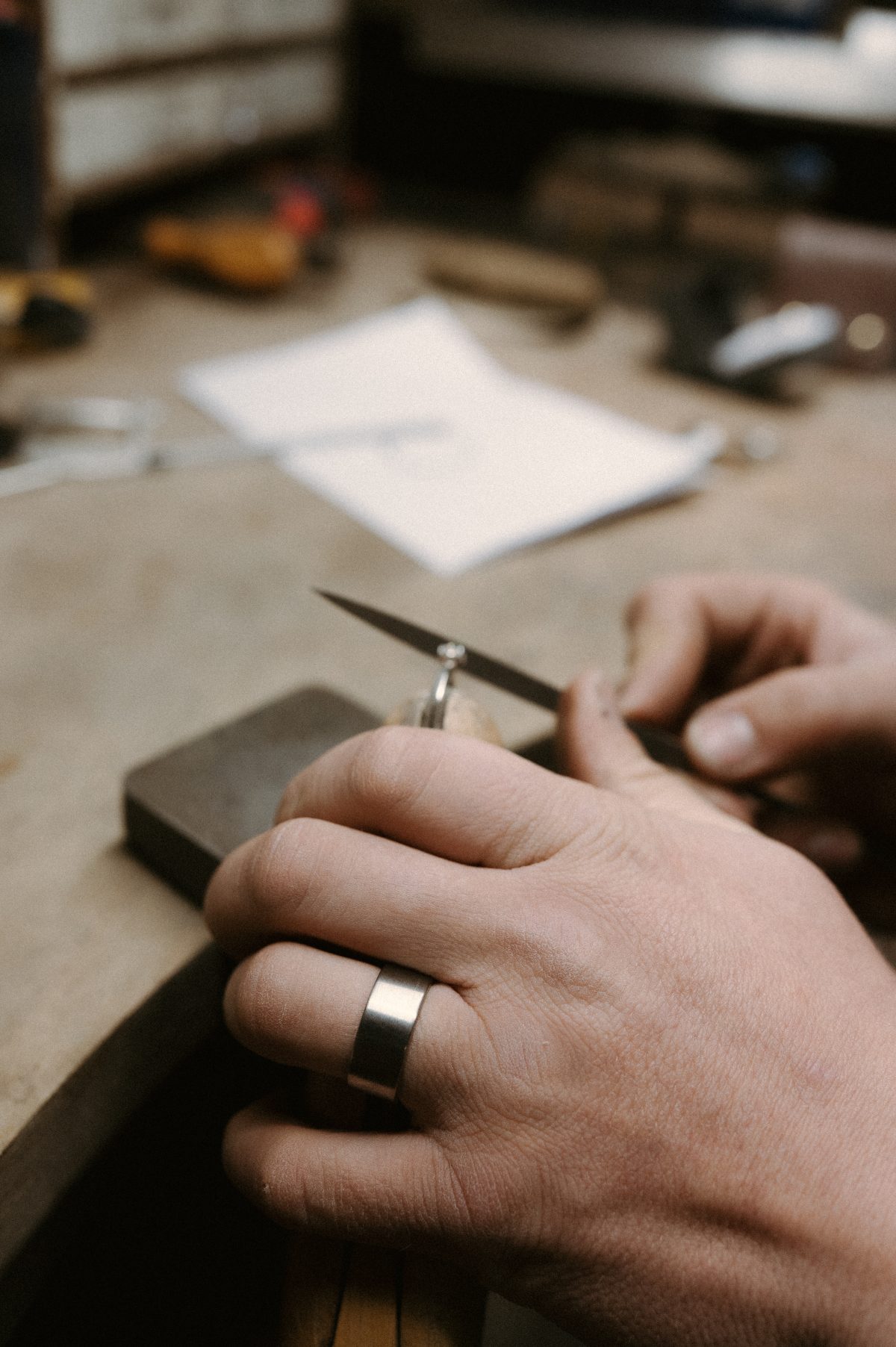 Titanium ring worn by James French at JWF Unique Designs. The flat profile titanium ring in a satin finish, a modern look.
