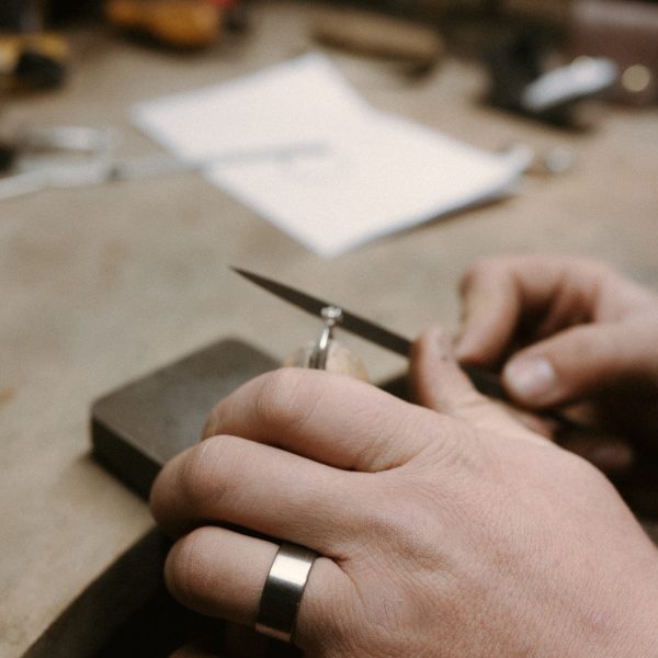 Titanium ring worn by James French at JWF Unique Designs. The flat profile titanium ring in a satin finish, a modern look.