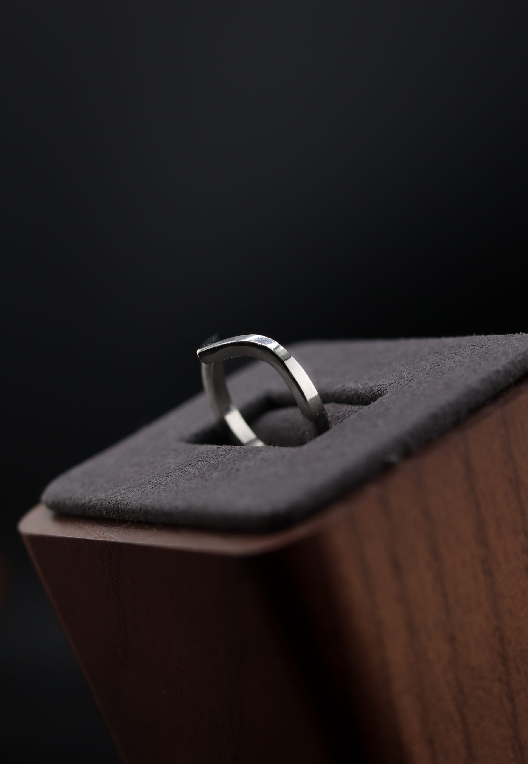 9E2A3613 1.65mm chevron wedding ring with a shaped V profile. Designed to sit neatly against an engagement ring. Slim, precise, and easy to wear. Available in sterling silver, white gold, and platinum. Ideal for women wanting a shaped wedding ring that follows the line of their engagement ring. Handmade in Devon, UK. Crafted by award-winning goldsmith James French at JWF Unique Designs.