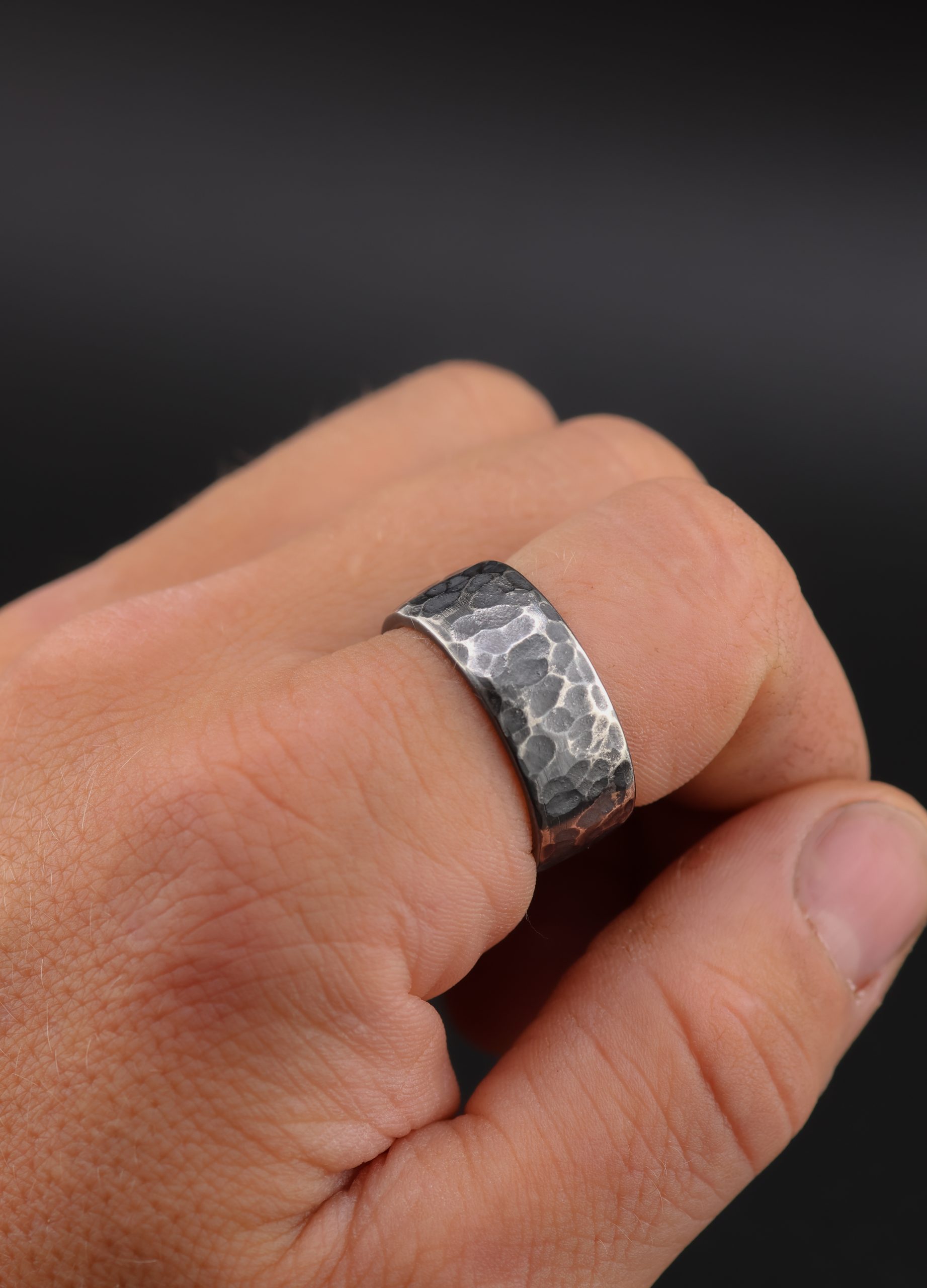 9E2A2173-3 Full crown coin ring in sterling silver with hammered outer texture. Dark patina finish with contrast across the surface. Interior shows St George slaying the dragon from original coin. Slightly rounded profile with a solid, heavy feel. Handmade in Devon, UK.