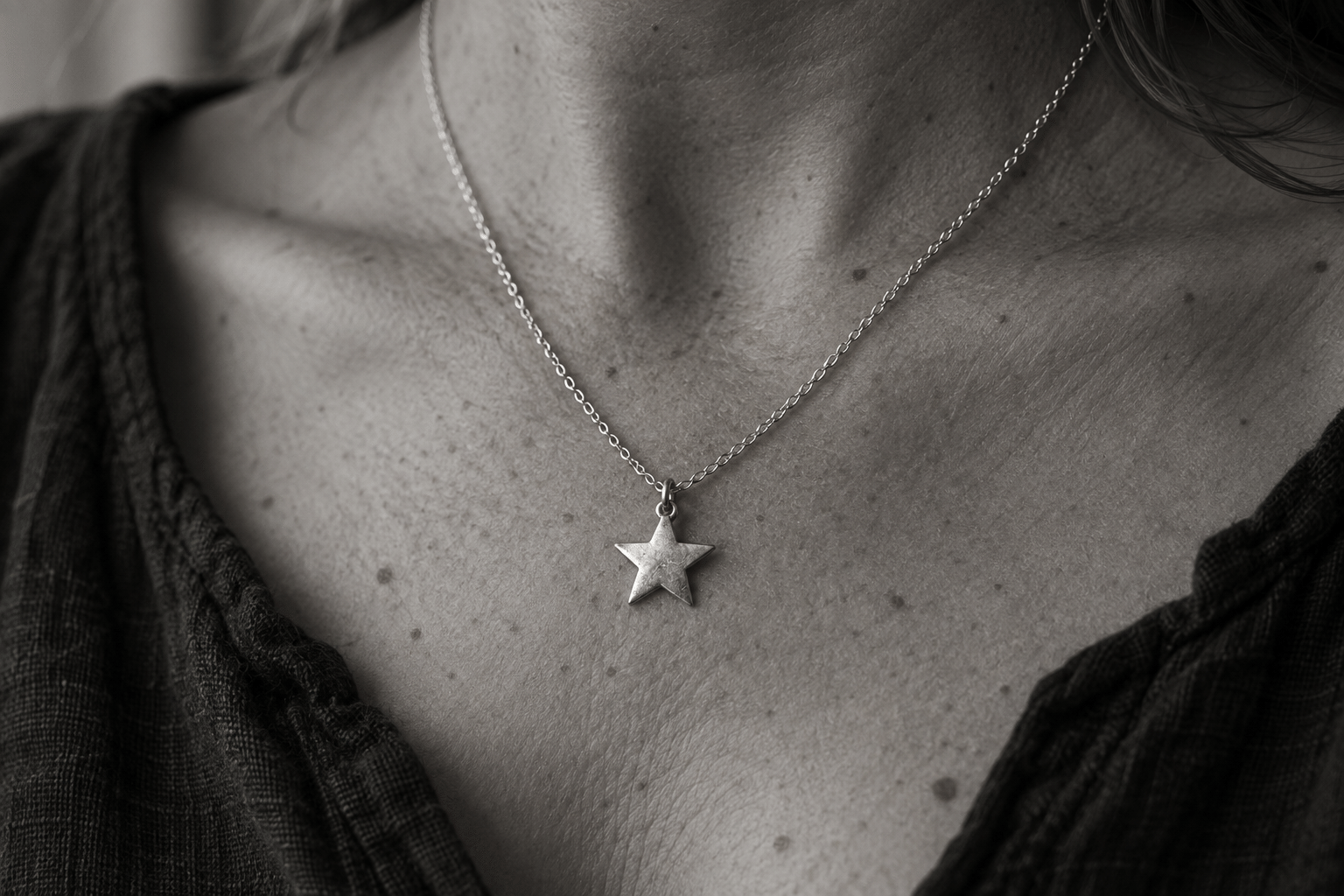 Star - JWF Unique Designs Sterling Silver Star Necklace, handmade by James French, award winning goldsmith in Devon, UK. The star pendant hangs on a 18 inc sterling silver chain.